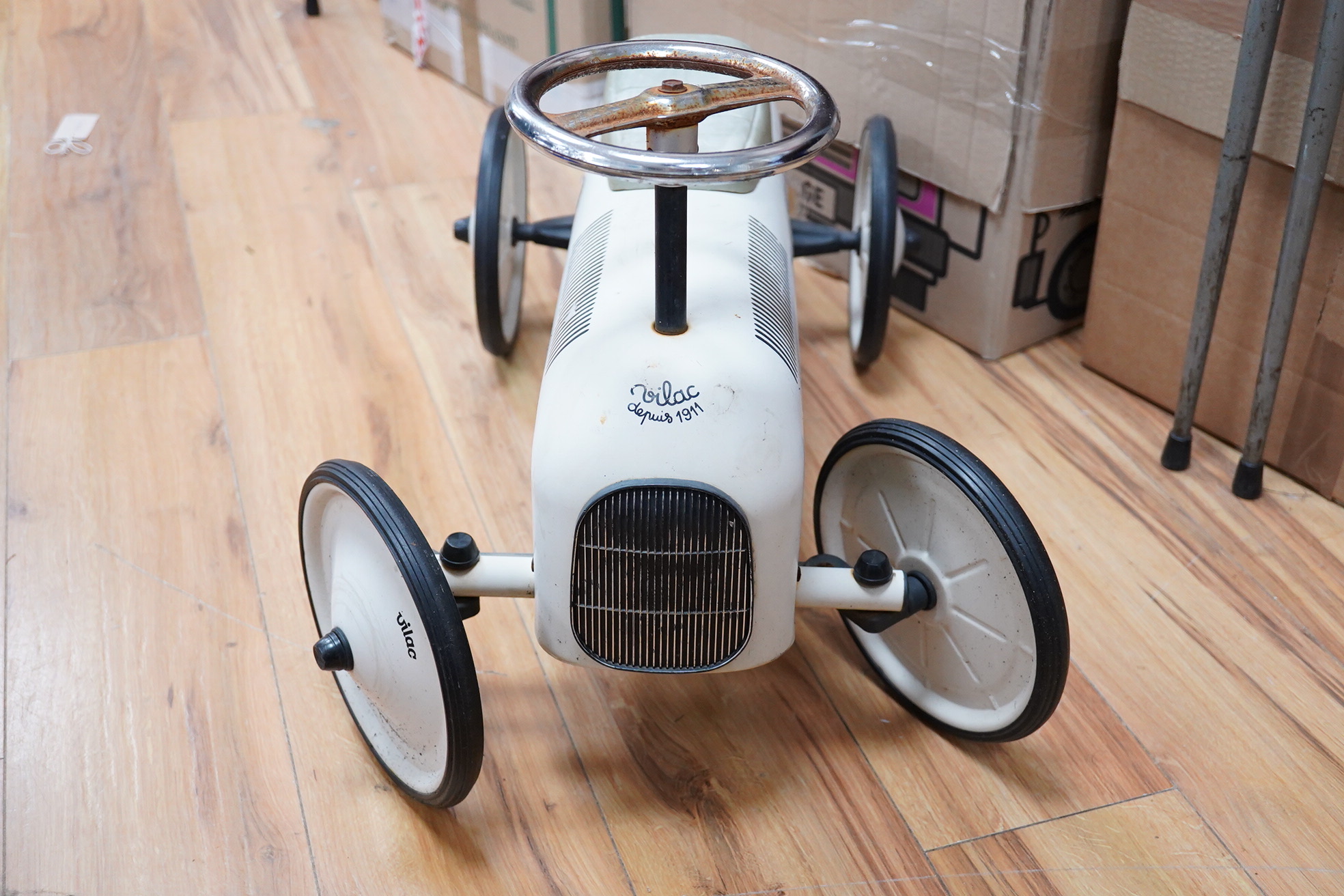 A mid 20th century Vilac child’s tinplate ride on car, body length 74cm